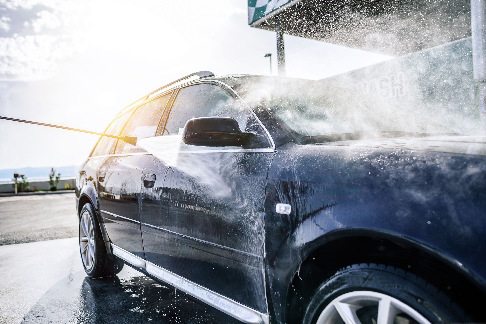 High-pressure washing car outdoors